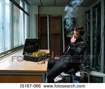Stock Photo - man smoking a 
cigar with briefcase 
of gold bars. 
fotosearch - search 
stock photos, 
pictures, images, 
and photo clipart