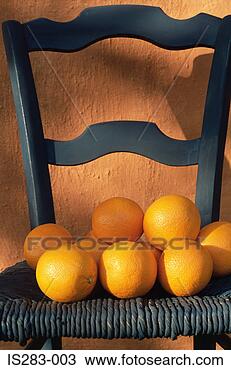 Stock Photo - oranges on a blue 
chair. fotosearch 
- search stock 
photos, pictures, 
images, and photo 
clipart