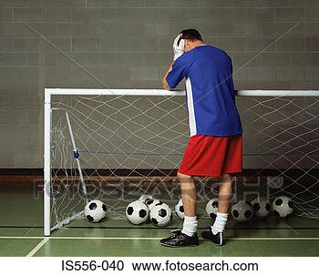 Stock Photography - defeated goalkeeper. 
fotosearch - search 
stock photos, 
pictures, images, 
and photo clipart