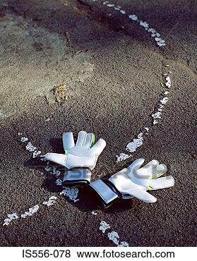 Stock Photo - goalkeeper gloves 
on playground. 
fotosearch - search 
stock photos, 
pictures, images, 
and photo clipart