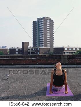 Stock Photo - woman doing yoga 
on roof. fotosearch 
- search stock 
photos, pictures, 
images, and photo 
clipart