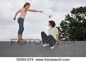 Stock Photo - angel casting 
a spell on a man. 
fotosearch - search 
stock photos, 
pictures, images, 
and photo clipart