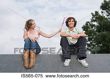 Stock Image - angel casting 
a spell on a man. 
fotosearch - search 
stock photos, 
pictures, images, 
and photo clipart
