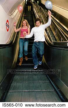 Stock Photography - couple with balloons 
on escalator. 
fotosearch - search 
stock photos, 
pictures, images, 
and photo clipart