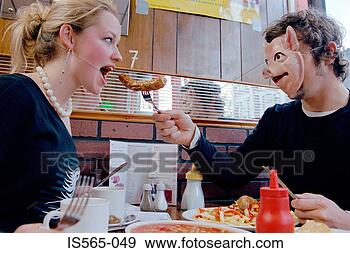 Stock Photograph - couple eating 
in cafe. fotosearch 
- search stock 
photos, pictures, 
images, and photo 
clipart