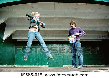 Stock Image - couple playing 
air guitar on 
stage. fotosearch 
- search stock 
photos, pictures, 
images, and photo 
clipart