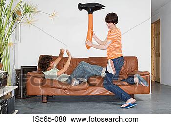 Stock Photo - couple playing 
with inflatable 
hammer. fotosearch 
- search stock 
photos, pictures, 
images, and photo 
clipart
