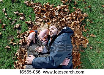 Stock Photo - couple sleeping 
on leaves. fotosearch 
- search stock 
photos, pictures, 
images, and photo 
clipart