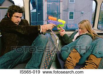 Stock Photograph - couple with water 
pistols. fotosearch 
- search stock 
photos, pictures, 
images, and photo 
clipart