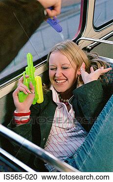 Stock Photography - couple with water 
pistols. fotosearch 
- search stock 
photos, pictures, 
images, and photo 
clipart