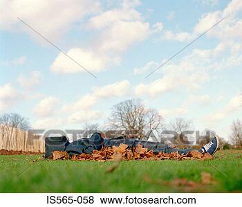 Stock Photo - man sleeping on 
leaves. fotosearch 
- search stock 
photos, pictures, 
images, and photo 
clipart