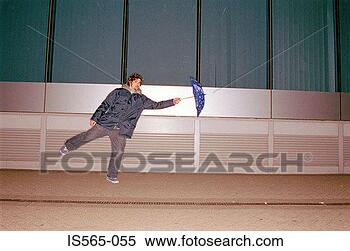 Stock Image - man with umbrella 
in wind. fotosearch 
- search stock 
photos, pictures, 
images, and photo 
clipart