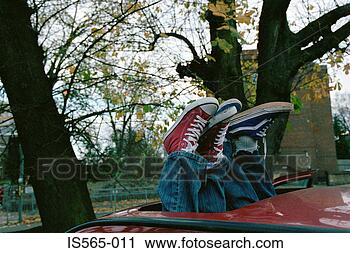 Stock Photography - trainers through 
automobile sunroof. 
fotosearch - search 
stock photos, 
pictures, images, 
and photo clipart