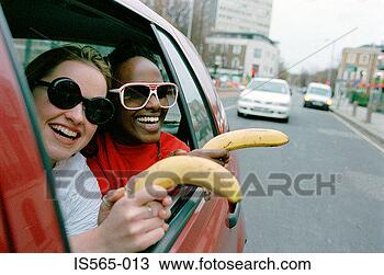 Stock Photo - women playing 
in automobile. 
fotosearch - search 
stock photos, 
pictures, images, 
and photo clipart