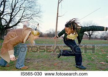 Stock Photography - women playing 
in park. fotosearch 
- search stock 
photos, pictures, 
images, and photo 
clipart