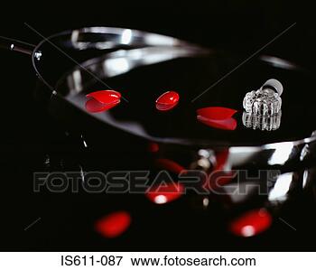 Picture - fake fingernails 
and a perfume 
bottle top. fotosearch 
- search stock 
photos, pictures, 
images, and photo 
clipart