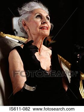 Stock Photo - senior woman with 
cigarette holder. 
fotosearch - search 
stock photos, 
pictures, images, 
and photo clipart