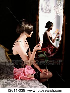 Stock Photograph - young woman holding 
rose. fotosearch 
- search stock 
photos, pictures, 
images, and photo 
clipart