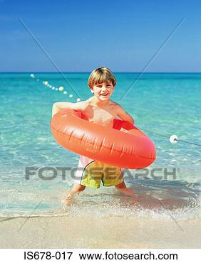 Picture - boy with an inflatable 
ring. fotosearch 
- search stock 
photos, pictures, 
images, and photo 
clipart