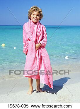 Stock Image - boy wrapped in 
a pink towel. 
fotosearch - search 
stock photos, 
pictures, images, 
and photo clipart