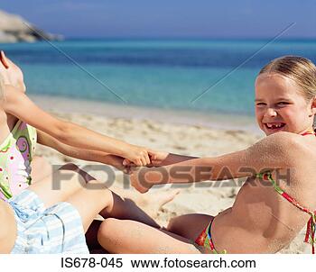 Stock Image - children playing 
on the beach. 
fotosearch - search 
stock photos, 
pictures, images, 
and photo clipart