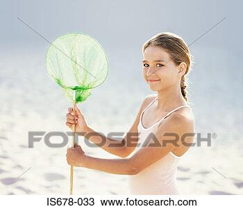 Stock Photo - girl holding a 
fishing net. fotosearch 
- search stock 
photos, pictures, 
images, and photo 
clipart