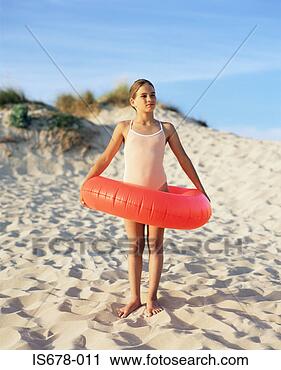 Stock Photography - girl with inflatable 
ring. fotosearch 
- search stock 
photos, pictures, 
images, and photo 
clipart