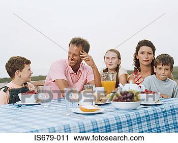 Stock Photography - family having 
breakfast al fresco. 
fotosearch - search 
stock photos, 
pictures, images, 
and photo clipart