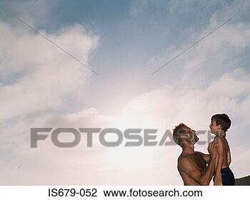 Stock Photo - father holding 
son. fotosearch 
- search stock 
photos, pictures, 
images, and photo 
clipart