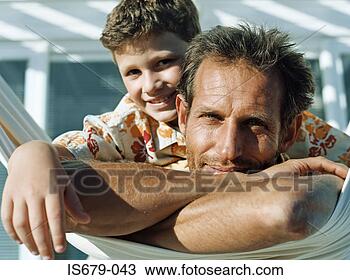 Stock Photo - father and son 
on hammock. fotosearch 
- search stock 
photos, pictures, 
images, and photo 
clipart