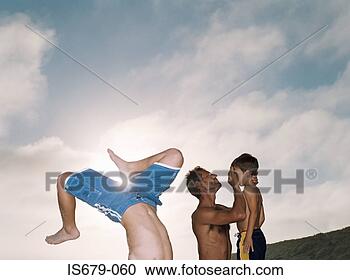 Stock Photography - man helping his 
injured son. fotosearch 
- search stock 
photos, pictures, 
images, and photo 
clipart