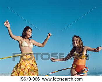 Stock Photo - mother and daughter 
with hula hoops. 
fotosearch - search 
stock photos, 
pictures, images, 
and photo clipart