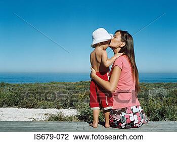 Stock Photo - mother kissing 
her son on the 
forehead. fotosearch 
- search stock 
photos, pictures, 
images, and photo 
clipart