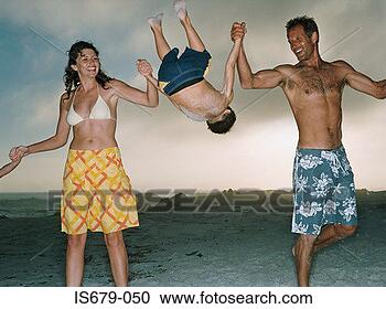 Stock Photography - parents swinging 
son in the air. 
fotosearch - search 
stock photos, 
pictures, images, 
and photo clipart