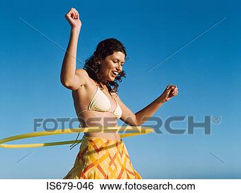 Stock Photo - woman playing 
with hula hoop. 
fotosearch - search 
stock photos, 
pictures, images, 
and photo clipart