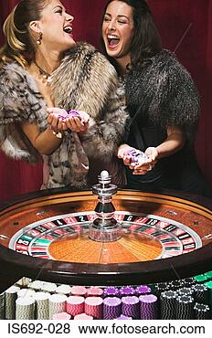 Stock Photo - women having fun 
at roulette wheel. 
fotosearch - search 
stock photos, 
pictures, images, 
and photo clipart