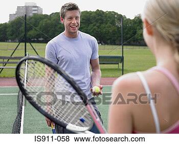 Stock Photo - man and woman 
on a tennis court. 
fotosearch - search 
stock photos, 
pictures, images, 
and photo clipart