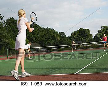 Stock Photo - young people playing 
tennis. fotosearch 
- search stock 
photos, pictures, 
images, and photo 
clipart