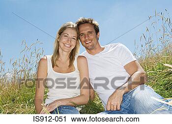 Stock Photography - young couple in 
a field. fotosearch 
- search stock 
photos, pictures, 
images, and photo 
clipart