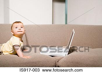 Stock Photo - baby on sofa with 
laptop. fotosearch 
- search stock 
photos, pictures, 
images, and photo 
clipart