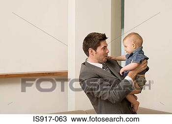 Stock Photo - businessman and 
his baby. fotosearch 
- search stock 
photos, pictures, 
images, and photo 
clipart