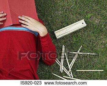 Stock Photo - boy covering his 
face with a book. 
fotosearch - search 
stock photos, 
pictures, images, 
and photo clipart