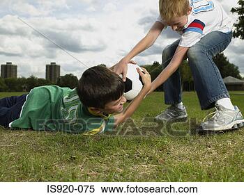 Stock Image - boys fighting 
over a football. 
fotosearch - search 
stock photos, 
pictures, images, 
and photo clipart