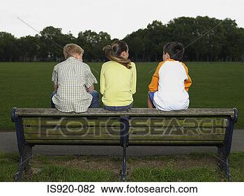 Stock Photo - children sitting 
on a park bench. 
fotosearch - search 
stock photos, 
pictures, images, 
and photo clipart