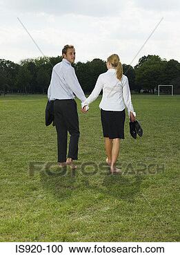 Stock Photography - couple leaving 
a park. fotosearch 
- search stock 
photos, pictures, 
images, and photo 
clipart