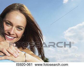 Stock Photography - young couple hugging. 
fotosearch - search 
stock photos, 
pictures, images, 
and photo clipart