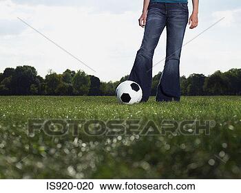 Stock Photography - young woman with 
a football. fotosearch 
- search stock 
photos, pictures, 
images, and photo 
clipart