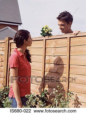 Stock Photo - man and woman 
talking over garden 
fence. fotosearch 
- search stock 
photos, pictures, 
images, and photo 
clipart