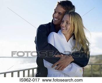Picture - couple on balcony 
in bathrobes. 
fotosearch - search 
stock photos, 
pictures, images, 
and photo clipart