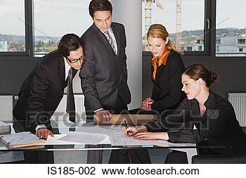 Stock Photo - businesspeople 
around desk. fotosearch 
- search stock 
photos, pictures, 
images, and photo 
clipart
